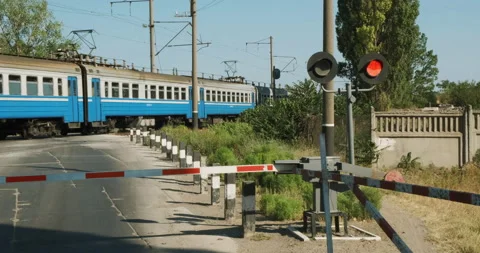 Stop sight, bad road, striped barrier. The crossing is closed soviet union train Video stock 146372291