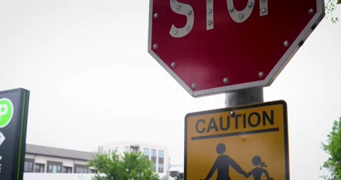 Stop Sign and Caution Pedestrian Crossing Sign Austin Texas Stock Footage 152495301