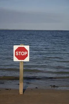 Stop sign on beach Фото