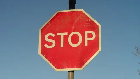Stop sign at dangerous road junction united kingdom Stock Footage 260176463
