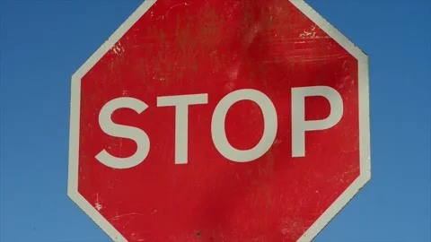 Stop sign at dangerous road junction united kingdom Stock Footage 260177256