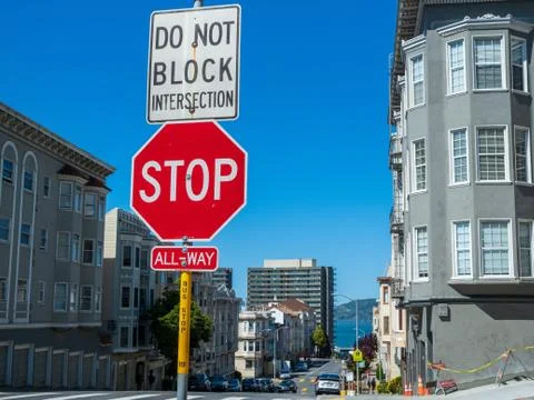 Stop sign do not block interaction hanging on post in urban city Stock Photos