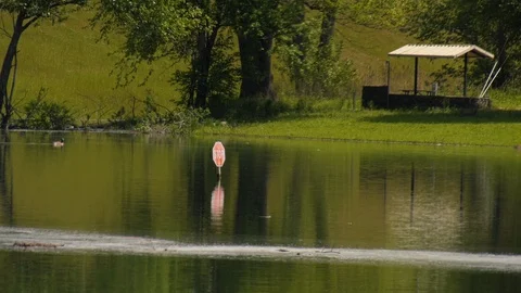 Stop sign in flooded water Stock Footage 107852950