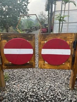 A stop sign in front of the door which means no entry Stock Photos