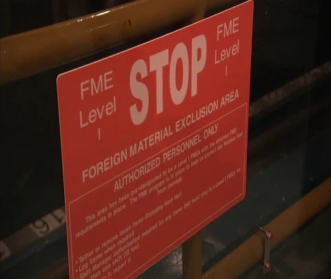 Stop sign outside foreign material exclusion area inside nuclear power plant Stock Footage 86692966