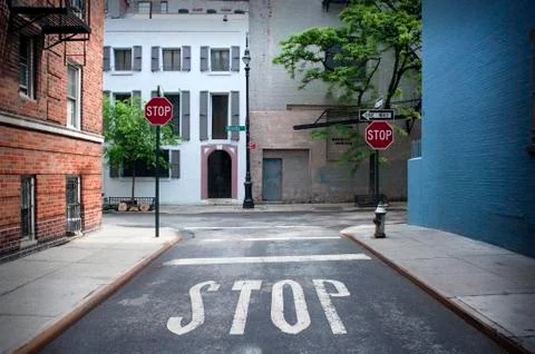 Stop Sign painted on the road Stock Photos