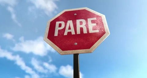Stop Sign Pare in Spanish Stock Footage 251609151