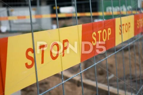 Stop sign ribbon on the construction site Stock Photos