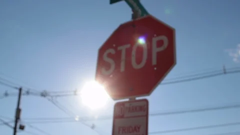 Stop sign slow move down sun light street sign 스톡 동영상 98439689
