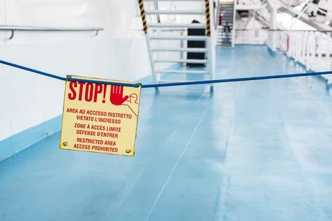 Stop sign on walking deck on the ship at sea Stock Photos