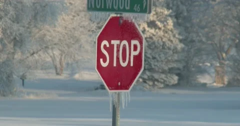 Stop Sign - Winter - Ice - Winter Driving Stock Footage 146099665