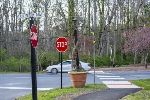 Stop Signs at Mount Gretna Intersection with Passing Car Stock Photos