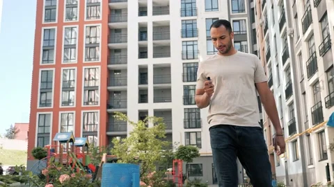 Stop smoking. African American man throws electronic cigarette into a trash. Stock Footage 221025341