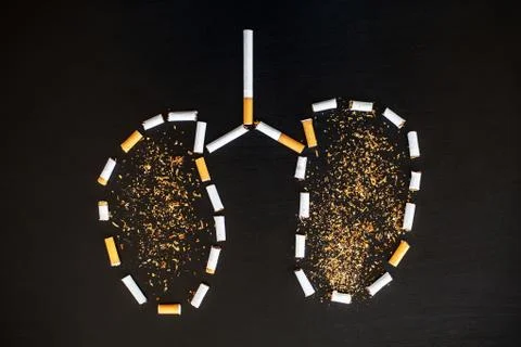 Stop smoking concept on background with broken cigarettes. Heap of cigarettes Stock Photos