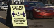 Stop The Spread Sign Warns Public To Stay 6 Feet Away Stock Footage