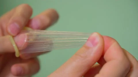 STOP STD. World AIDS Day. Super safe strawberry condoms. Selective focus Stock Footage 198804145