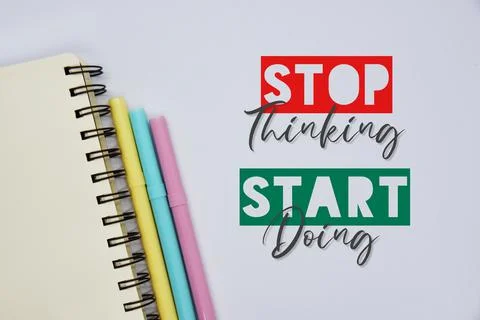'Stop thinking, start doing' quote on the white background Foto stock