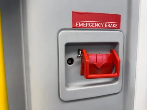 Stop valve with seal on wall inside train. Safety feature to prevent danger.. Stock Photos