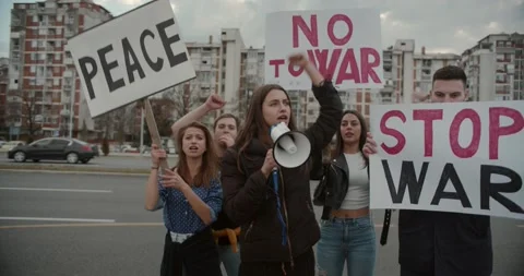 Stop the war, end the war protests with signs to act now and save the peace Stock Footage 171084565