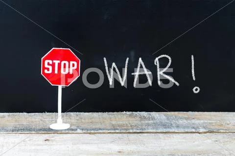 STOP WAR message written on chalkboard Stock Photos
