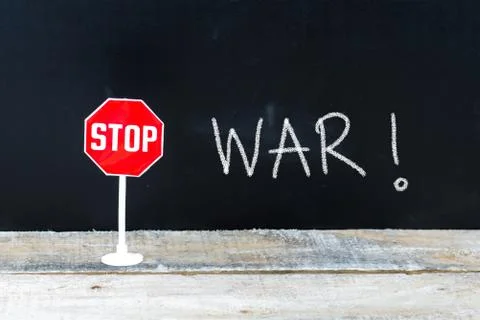 STOP WAR message written on chalkboard Stock Photos