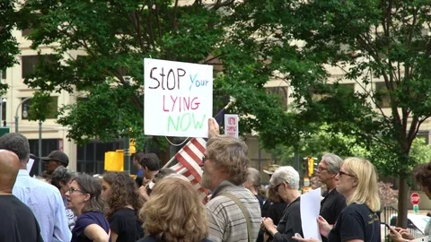 Stop your lying now says an Atlanta protester sign against Donald Trump Stock Footage 76834557