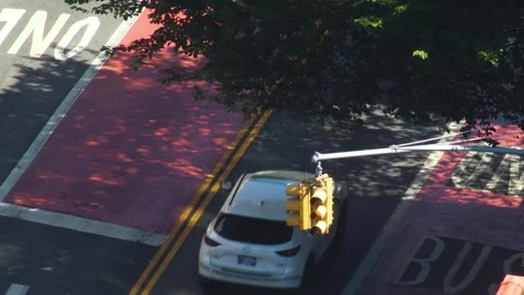 Stoplight traffic light changing from green to red over traffic aerial view, 4K Stock Footage 339597826