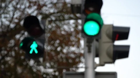 Stoplight. Traffic lights work in a big city at a crossroads. Slow motion. Stock Footage 97074220