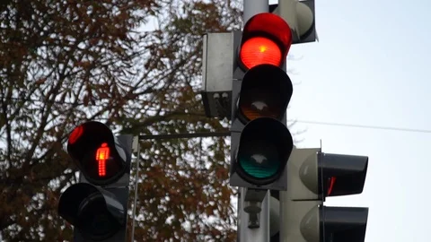 Stoplight. Traffic lights work in a big city at a crossroads. Slow motion. Stock Footage 97074284