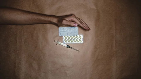 Stopmotion medical things changing at hand. Stay home. Wear a mask. COVID-19 Stock Footage 129773991