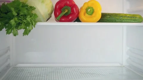 Stopmotion from the start of The empty shelves Of refrigerator to filling them Stock Footage 51001634