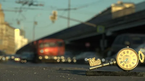 The stopped clock in the background of the road. Video stock 61696966