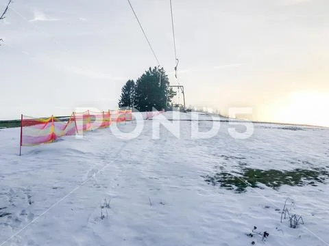 Stopped ski elevator in poor snow weather white skiing slope hill in germany Stock Photos