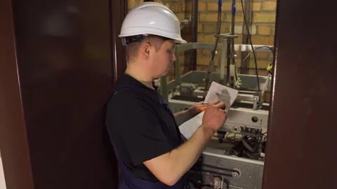Stopping the elevator for maintenance. Technical supervision of elevator Stock Footage 265258003