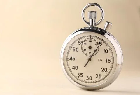 Stopwatch closeup on beige background Stock Photos