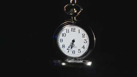 A stopwatch hangs in a black void, back lit, as the seconds tick by in slow Stock Footage 342882823