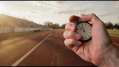 Stopwatch Held At Start Line On Running Track For Speed And Athletics Focus Video stock 320287858