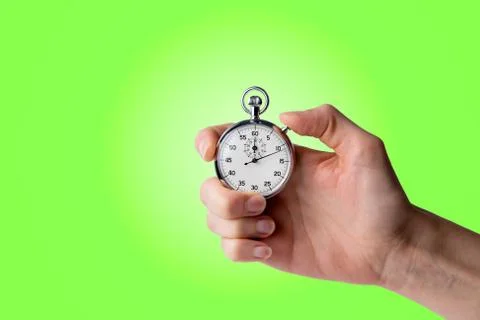 Stopwatch hold in hand, button pressed Stock Photos