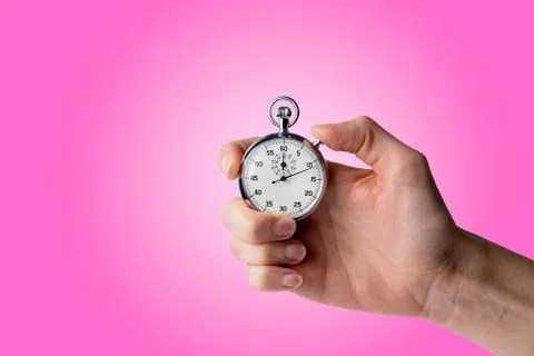 Stopwatch hold in hand, button pressed Stock Photos