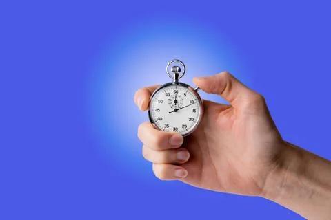 Stopwatch hold in hand, button pressed Stock Photos