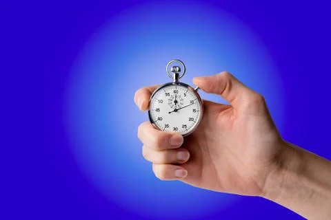 Stopwatch hold in hand, button pressed Stock Photos
