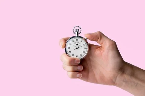 Stopwatch hold in hand, button pressed Stock Photos