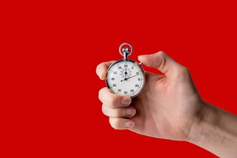 Stopwatch hold in hand, button pressed Stock Photos
