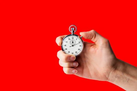 Stopwatch hold in hand, button pressed Stock Photos