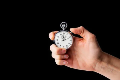 Stopwatch hold in hand, button pressed Stock Photos