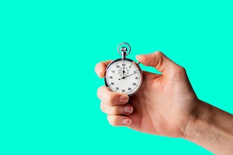Stopwatch hold in hand, button pressed, aqua menthe background Stock Photos