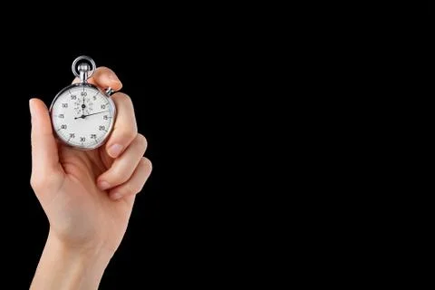 Stopwatch hold in hand, button pressed, black back ground Stock Photos