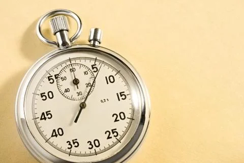 Stopwatch isolated on yellow Foto stock