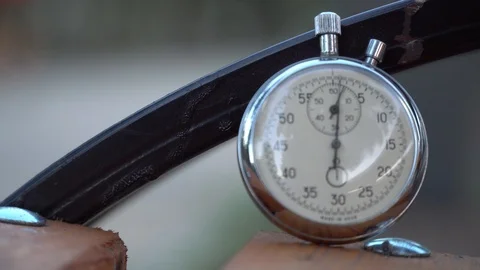 Stopwatch lies on bench, time shift concept Stock Footage 93652756