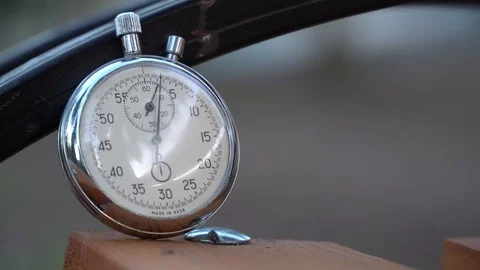 Stopwatch lies on bench, time shift concept Stock Footage 93653330